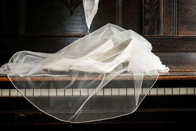 Close-Up of White Bridal Shoes and Veil on Piano Keys - Download Free Stock Photos Pikwizard.com