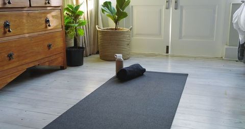 Cozy home workout space with mat and fitness essentials
