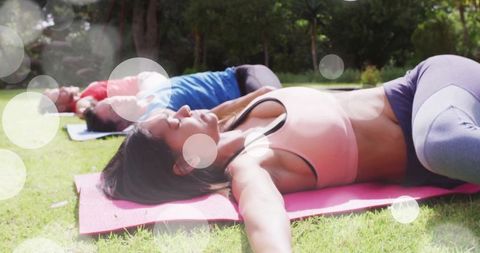 Women Relaxing Outdoor After Yoga under Sunlight in Green Park