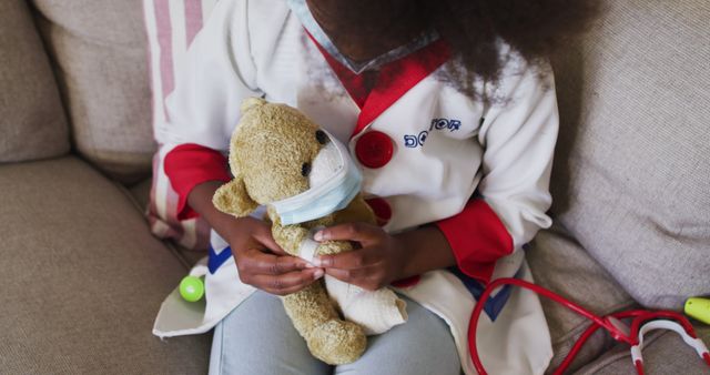 Child Pretending to Be a Doctor with Teddy Bear Patient - Download Free Stock Images Pikwizard.com