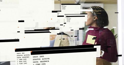 Woman leading team at glass board holding sticky note with code glitch overlays