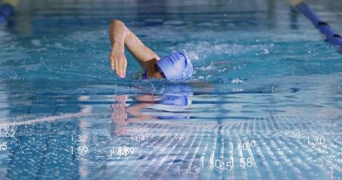 Professional swimmer practicing freestyle stroke in competitive pool