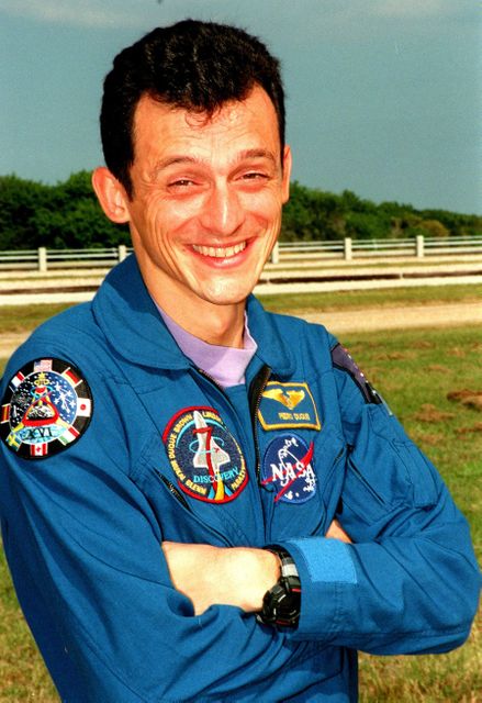 STS-95 Mission Specialist Pedro Duque of Spain, with the European Space Agency (ESA), smiles for the camera from Launch Pad 39B. The STS-95 crew were making final preparations for launch, targeted for liftoff at 2 p.m. on Oct. 29. Other crew members not shown are Mission Commander Curtis L. Brown Jr., Pilot Steven W. Lindsey, Mission Specialists Scott E. Parazynski, Stephen K. Robinsion, and and Payload Specialists John H. Glenn Jr., senator from Ohio, and Chiaki Mukai, with the National Space Development Agency of Japan (NASDA). The STS-95 mission is expected to last 8 days, 21 hours and 49 minutes, returning to KSC at 11:49 a.m. EST on Nov. 7