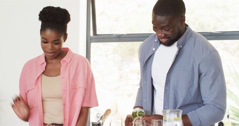 Happy Family Gathering in Kitchen with Smiling Couple