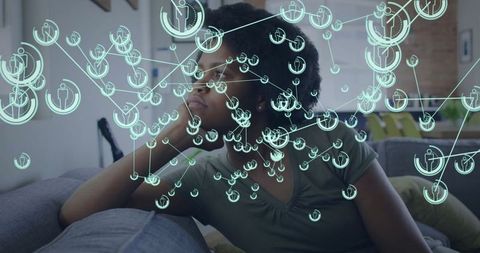 Woman Relaxing at Home with Network Technology Overlay