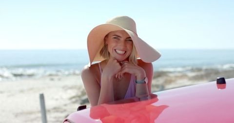 Joyful Woman Enjoying Sunny Beach Road Trip