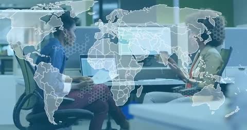 Two women collaborating at desk while world map overlay highlighting global analytics and KPIs