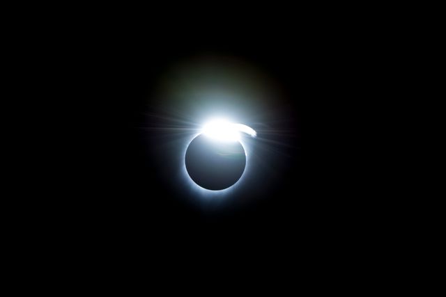 The diamond-ring effect occurred at the beginning and end of totality during a total solar eclipse. As the last bits of sunlight pass through the valleys on the moon's limb, and the faint corona around the sun is just becoming visible, it looks like a ring with glittering diamonds on it. Credit: (NASA/Carla Thomas)