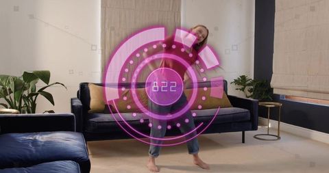 Woman dancing with futuristic magenta ar hud display in cozy living room