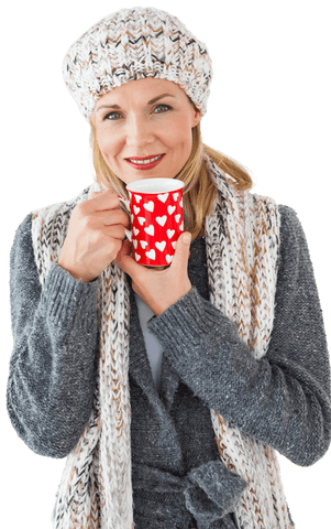 Smiling woman in winter attire holding heart mug on transparent background
