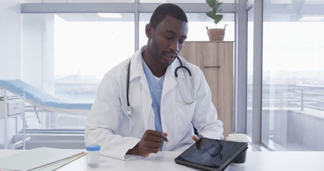 African American Male Doctor Using Tablet Computer in Bright Office - Download Free Stock Images Pikwizard.com