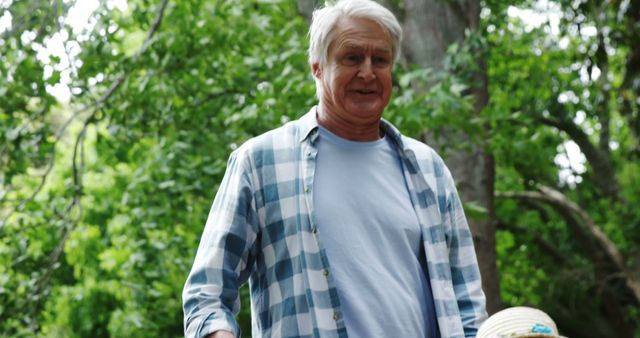 Elderly Man Enjoying Outdoor Activities in Nature Park - Download Free Stock Images Pikwizard.com