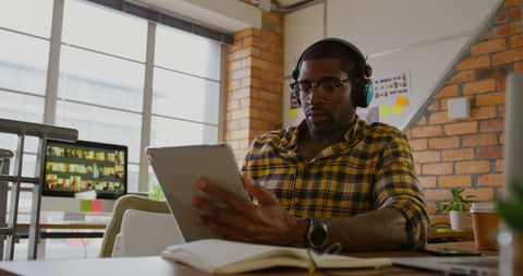 Creative professional using digital tablet in modern workspace