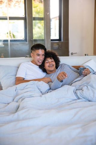 Couple Relaxing in Cozy Bedroom Setting