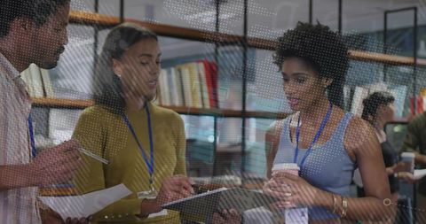 Professional team discusses ideas in modern office library