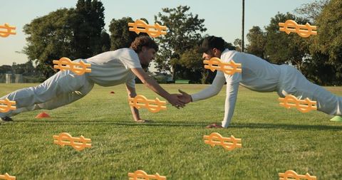 Athletes performing plank handshake training on grass with dollar overlay concept