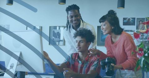 Young creative team discussing project at modern office space