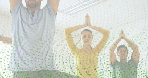 Group practicing tree pose in bright studio with binary code overlay for digital wellness