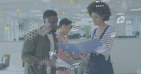 Young professionals collaborating over tablet and blue folder with futuristic data overlays