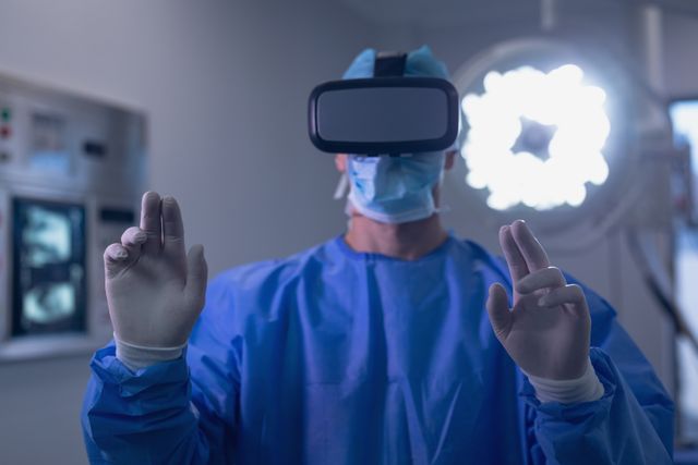 Male surgeon using virtual reality headset in operating room at hospital