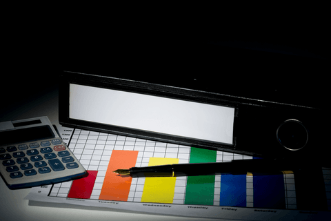 transparent business workspace with binder calculator and graph - Download Free Stock Videos Pikwizard.com