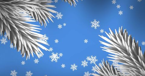 Festive Winter Snowfall with Pine Branches Against Blue Background