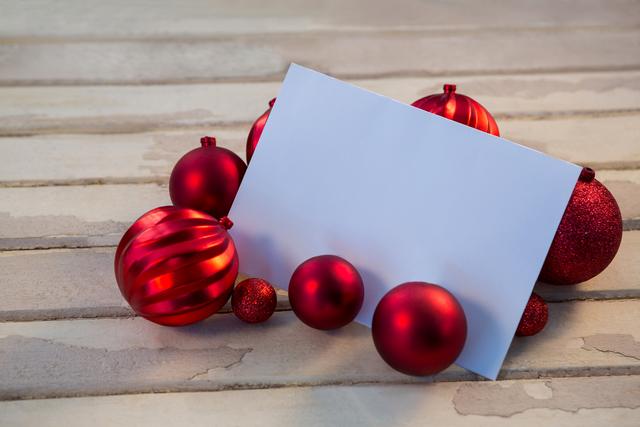 Blank Card with Red Christmas Baubles on Wooden Plank - Download Free Stock Photos Pikwizard.com
