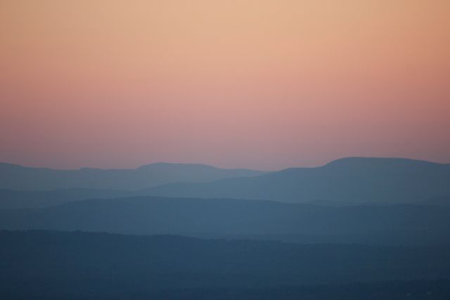 Gradient Sunset Over Silhouetted Mountain Ranges - Download Free Stock Photos Pikwizard.com