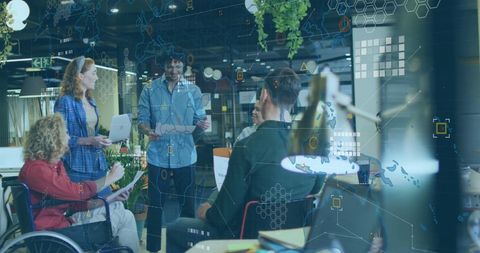 Diverse Team Collaborating in Modern Office with Digital Business Interface