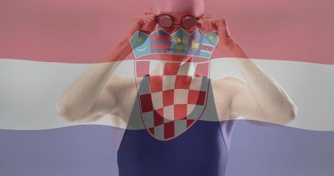 Competitive swimmer adjusting goggles in pink cap with croatian flag overlay