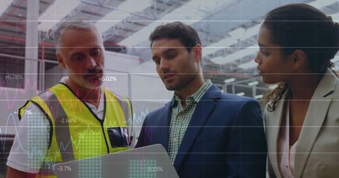Diverse Team Analyzing Data on Tablet in Warehouse - Download Free Stock Images Pikwizard.com