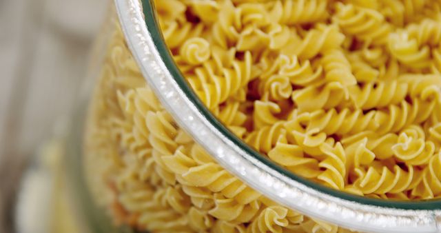 Close Up of Uncooked Fusilli Pasta in Glass Jar - Download Free Stock Images Pikwizard.com