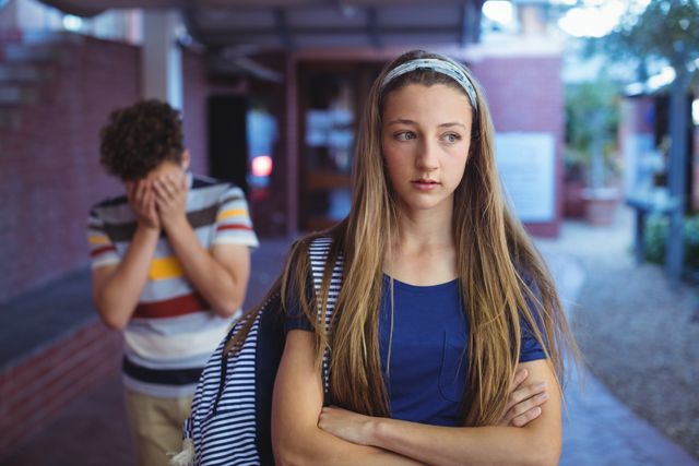Upset Teenagers Ignoring Each Other in School Campus - Download Free Stock Photos Pikwizard.com