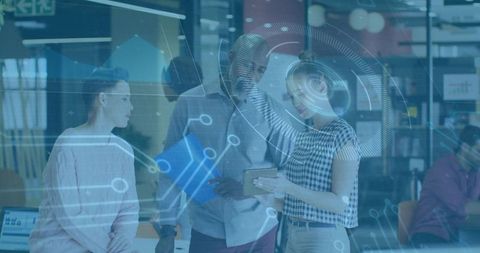 Professionals collaborating over tablet with augmented reality overlay in modern office