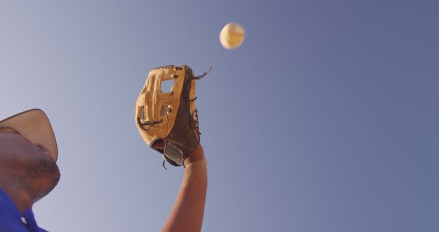 Baseball Player Catching Ball Under Clear Blue Sky - Download Free Stock Images Pikwizard.com