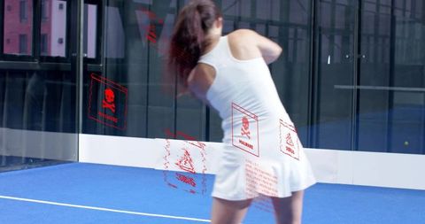 Female padel player swinging on indoor blue court with red malware overlays motion blur