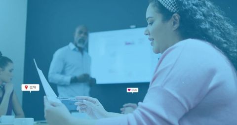 Focused Woman Analyzing Business Report in Meeting