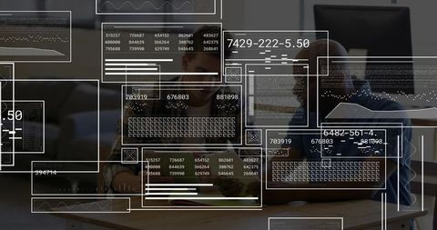 Collaborating developers reviewing code and analytics overlays on laptop in modern workspace