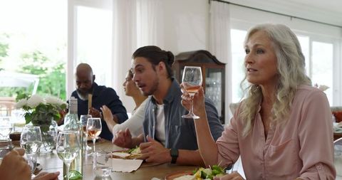 Sophisticated wedding reception guests toasting celebration