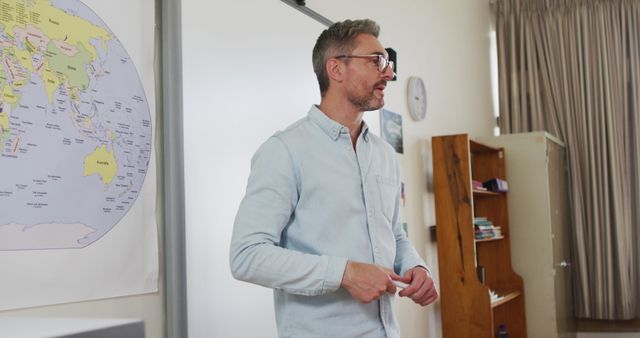 Male Teacher Giving Geography Lesson in Classroom - Download Free Stock Images Pikwizard.com