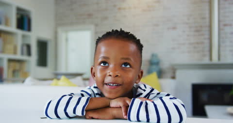 Joyful African American Boy Engaging in Video Call at Home