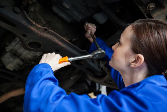 Female mechanic repairing a car - Download Free Stock Photos Pikwizard.com