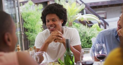 Cheerful Friends Enjoying Dinner Party