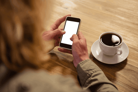 Transparent Smartphone Use in Cafe with Coffee Cup - Download Free Stock Videos Pikwizard.com