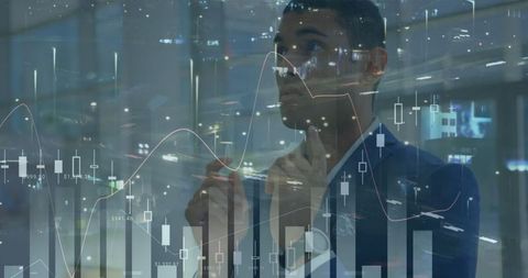 Businessman analyzing stock market data with futuristic overlay