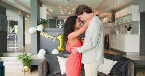 Multiracial Couple Celebrating Anniversary at Home