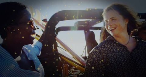 Two friends enjoying off-road adventure in sunlit countryside