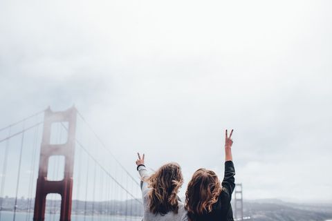 Friends Celebrating at Golden Gate Bridge, Enjoying View