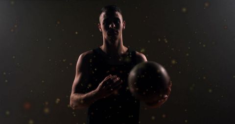 Basketball player holding ball with dynamic particles effect