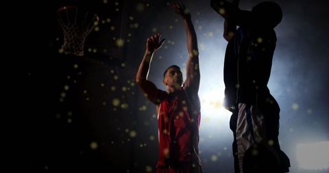 Dramatic basketball game in action against a luminous backdrop